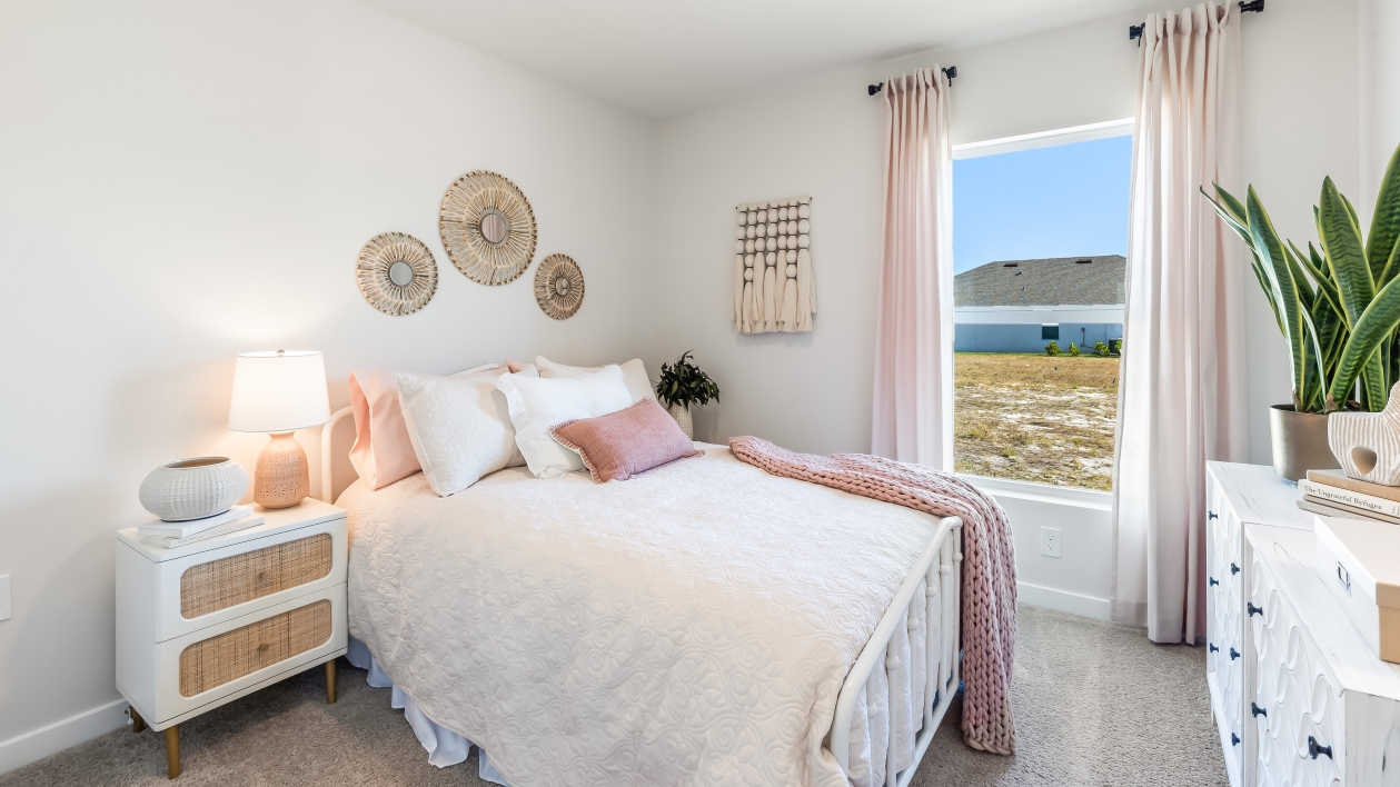 Inside of the secondary bedroom. Closet space and a nice window to bring natural light