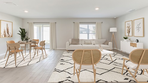 Inside the Freeport living room. Grey wood tiles and off-white walls. Contains one large couch, one small coffee table, two chairs, shelf storage cabinets, and lamp in the corner. Connects to dining room, kitchen, outdoor patio, and hallway to front door.