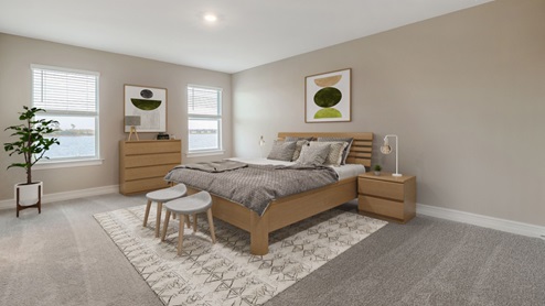 Inside the Coral Second bedroom with two windows. The floors are carpeted and walls are painted.