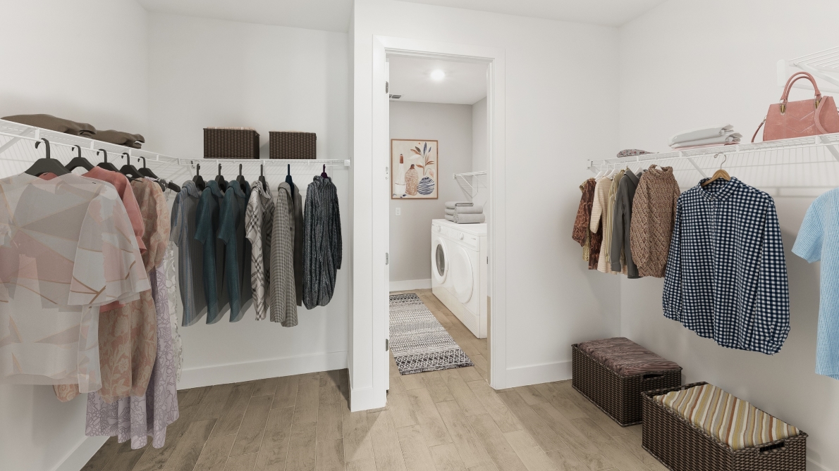 Inside of the Shelby model primary bedroom walk in closet. Connected to the laundry room