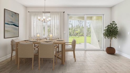 Inside the Clifton with a view of the dining room table and the sliding doors to the outside landscaped area. The Dining table holds 6 people and the floor is tiled.