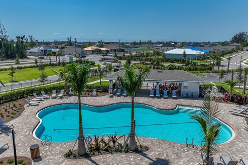 Arial view of the pool with shaded and sun seating as well as table seating options.