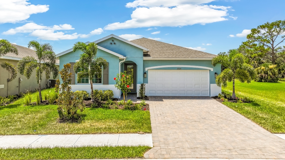 Outside of the Clifton A Model Home. Paver driveway and two car garage