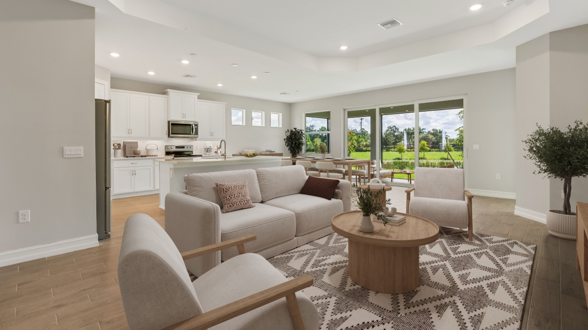 Inside of the Shelby home. View of the dining room. Couch, coffee, table, and rug shown.