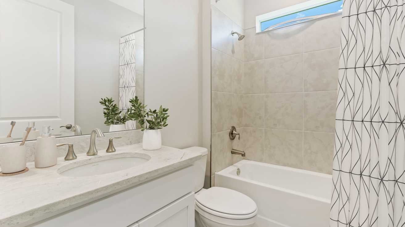 Inside of the Shelby model second bathroom. View of the toilet and sink