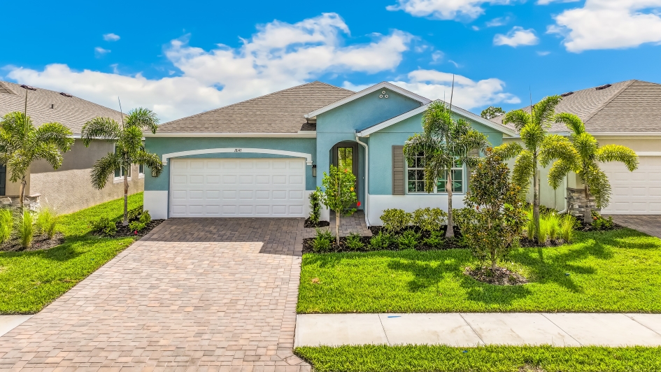 Outside of the Clifton A Model. Paver driveway and two car garage