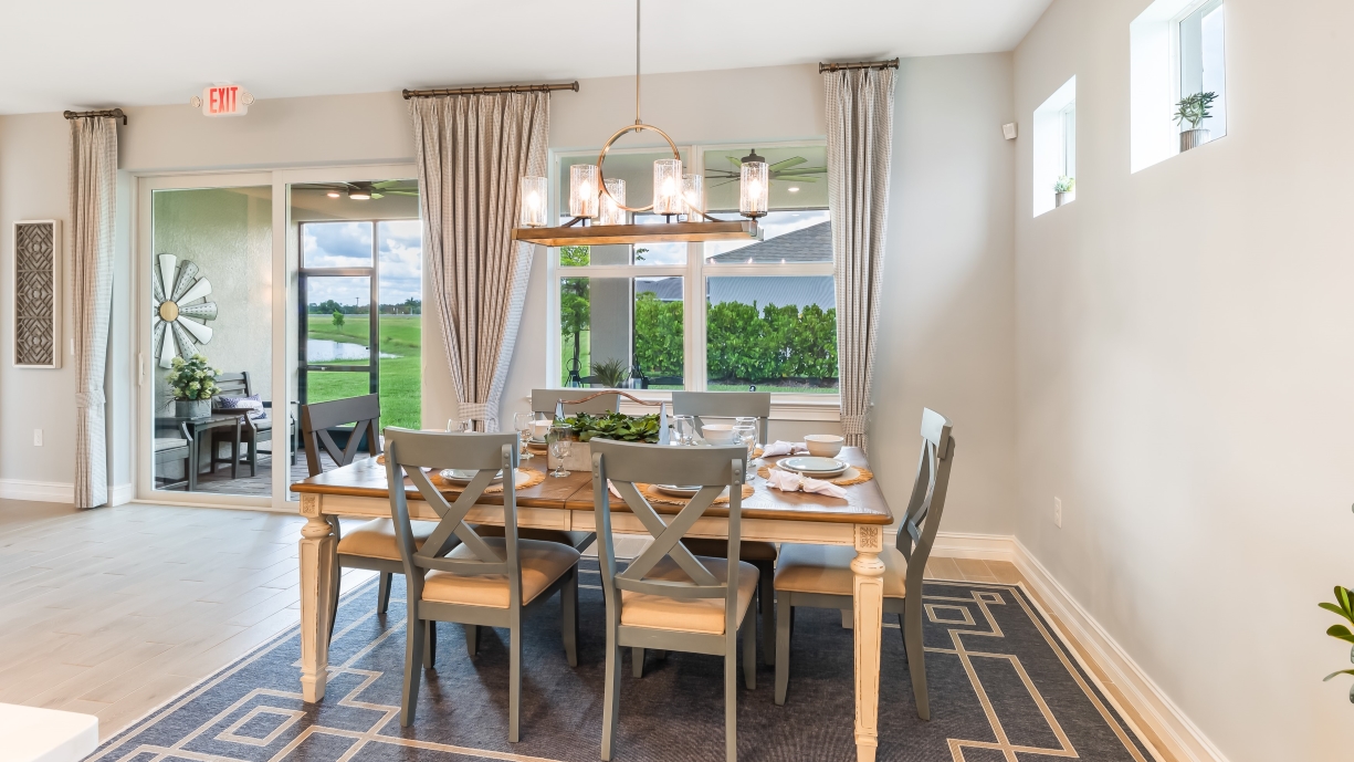 Inside of the Delray model dining room. Looking out to the lanai.