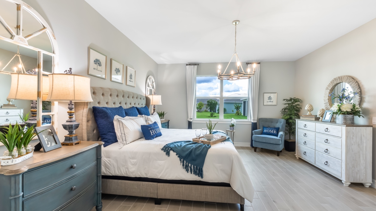 Inside of the primary bedroom. Window that brings in natural light. Built-in walk-in closet.