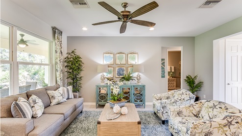 Beach-style living area with sofa, chairs, and coffee table.