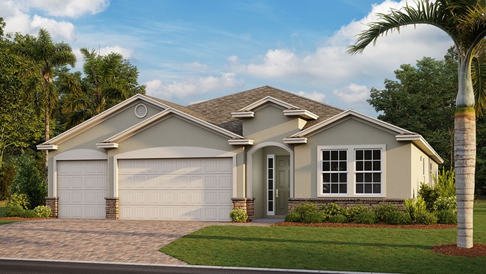 Outside of the Destin model. Yellow home with three car garage, two windows, and front door. Mixed paver driveway.