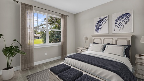 Inside of the Delray B model bedroom three. Grey carpet with off-white walls. Room contains one bed with nightstands on either side of bed and a bench at the end of the bed. Room also contains a window.