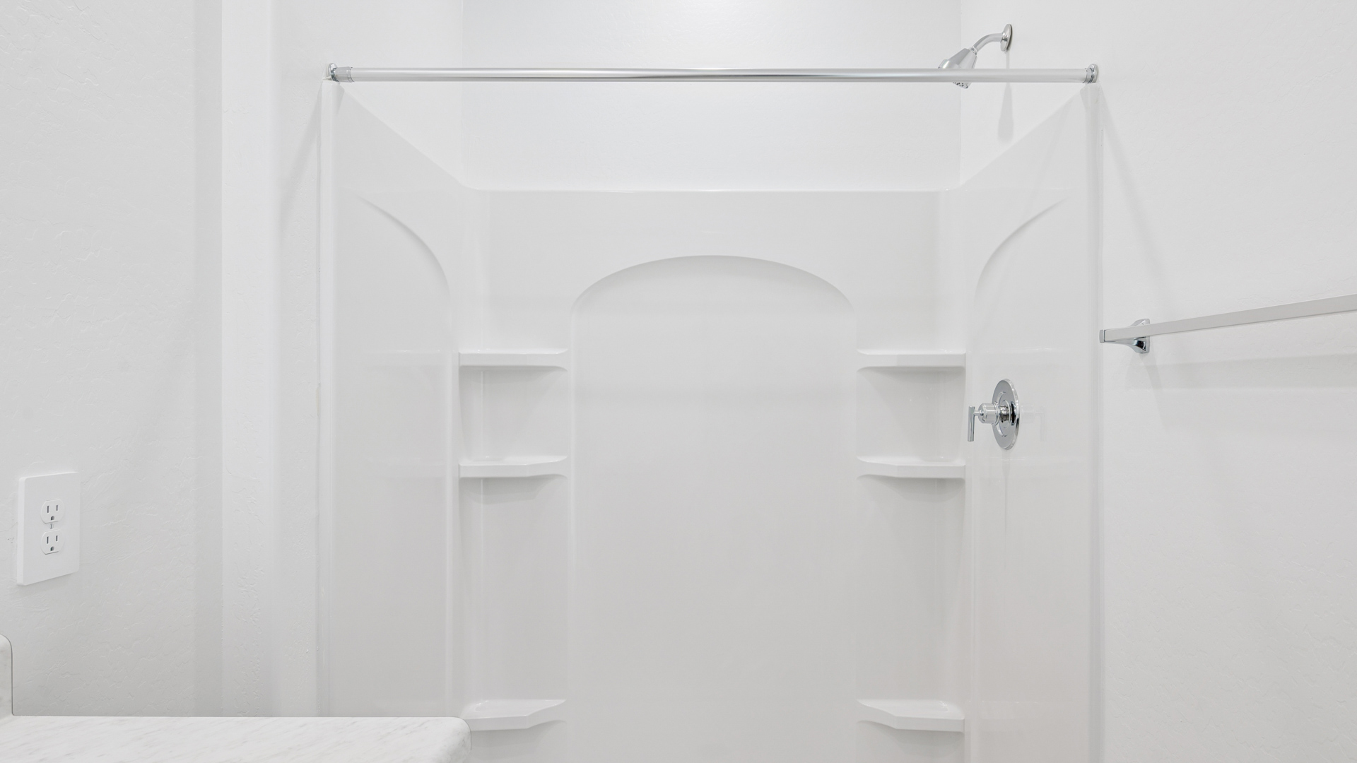 primary bathroom with dual vanities