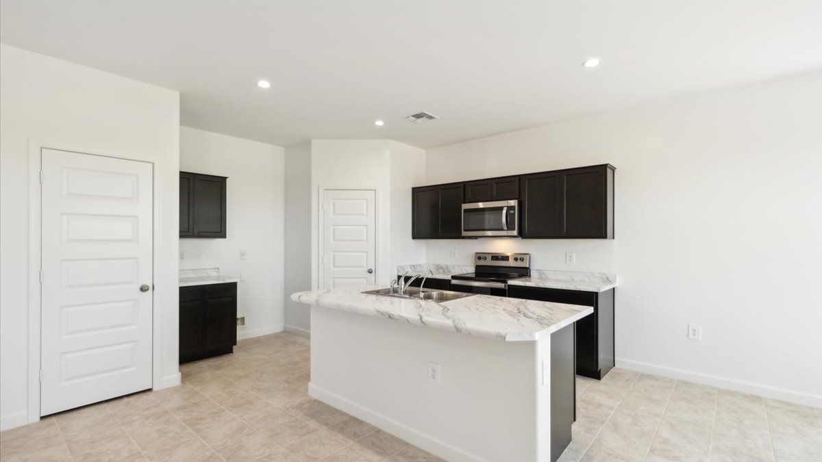 Kitchen with walk-in pantry and storage closet