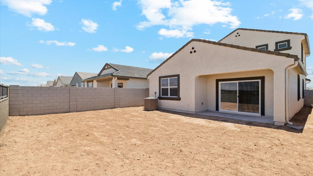 Large fenced-in backyard with a covered patio, perfect for outdoor entertaining.