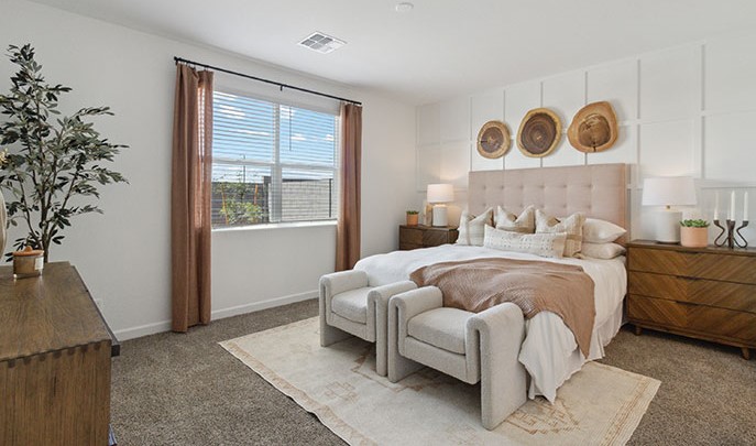 Harris bedroom with windows and carpet flooring