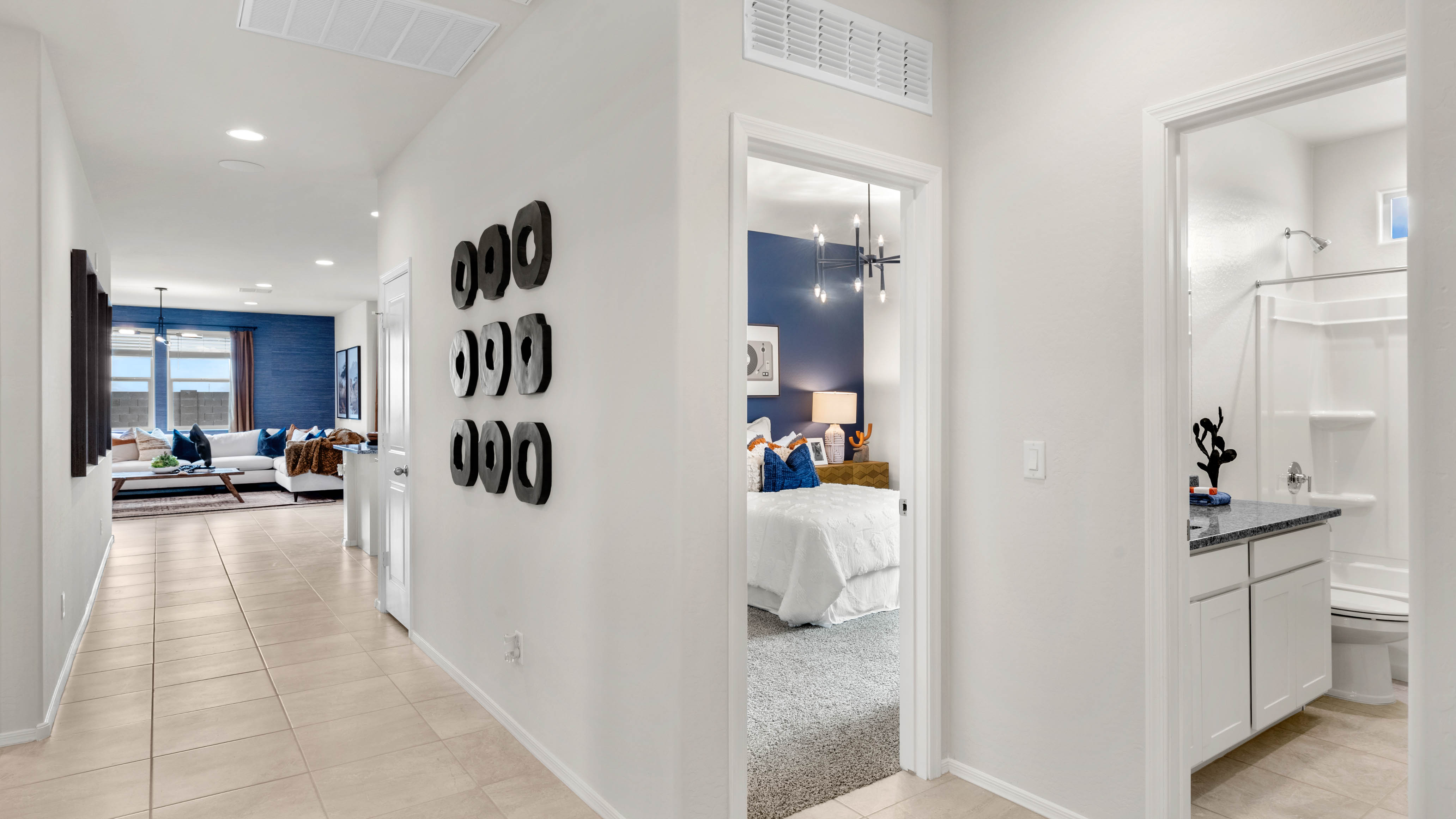 Entry hallway leading to living room and kitchen in the background.