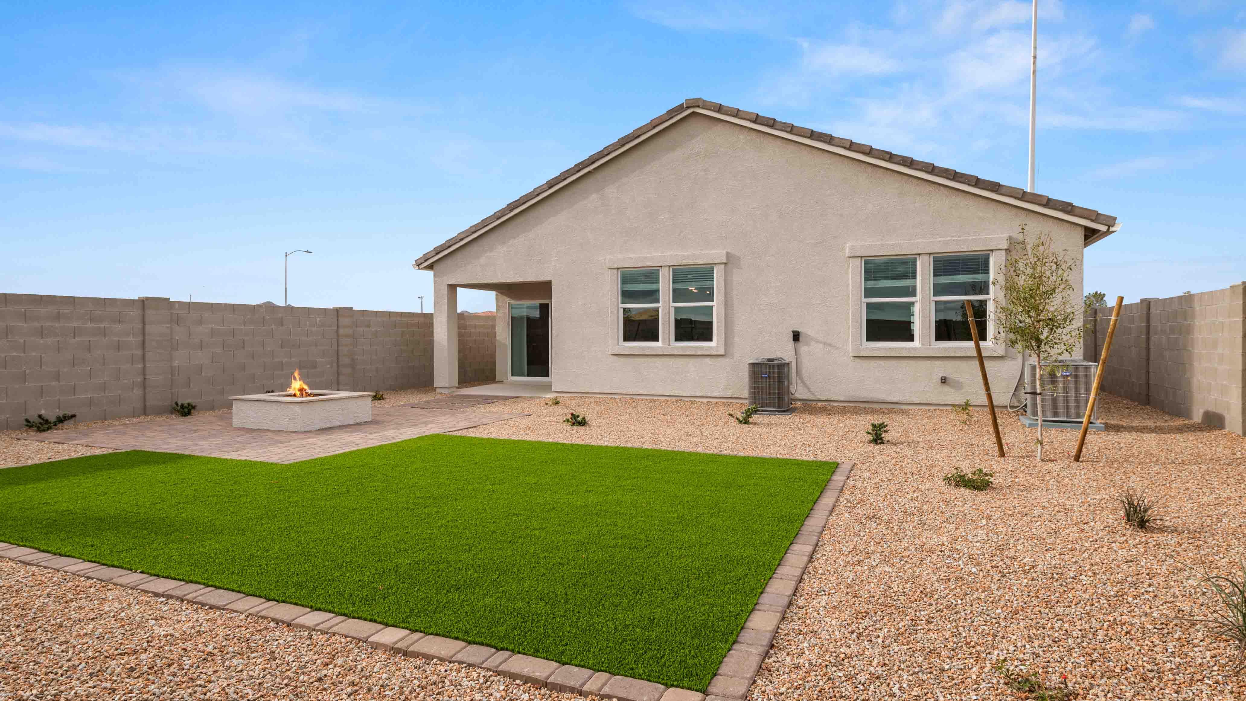 Large fenced-in backyard with a covered patio, perfect for outdoor entertaining.