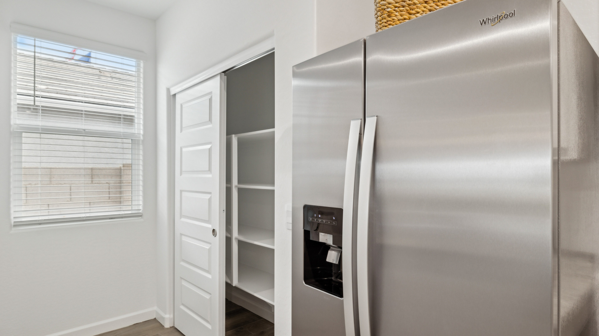 Bright and spacious kitchen with granite countertops, stainless steel appliances, and an island with bar seating.