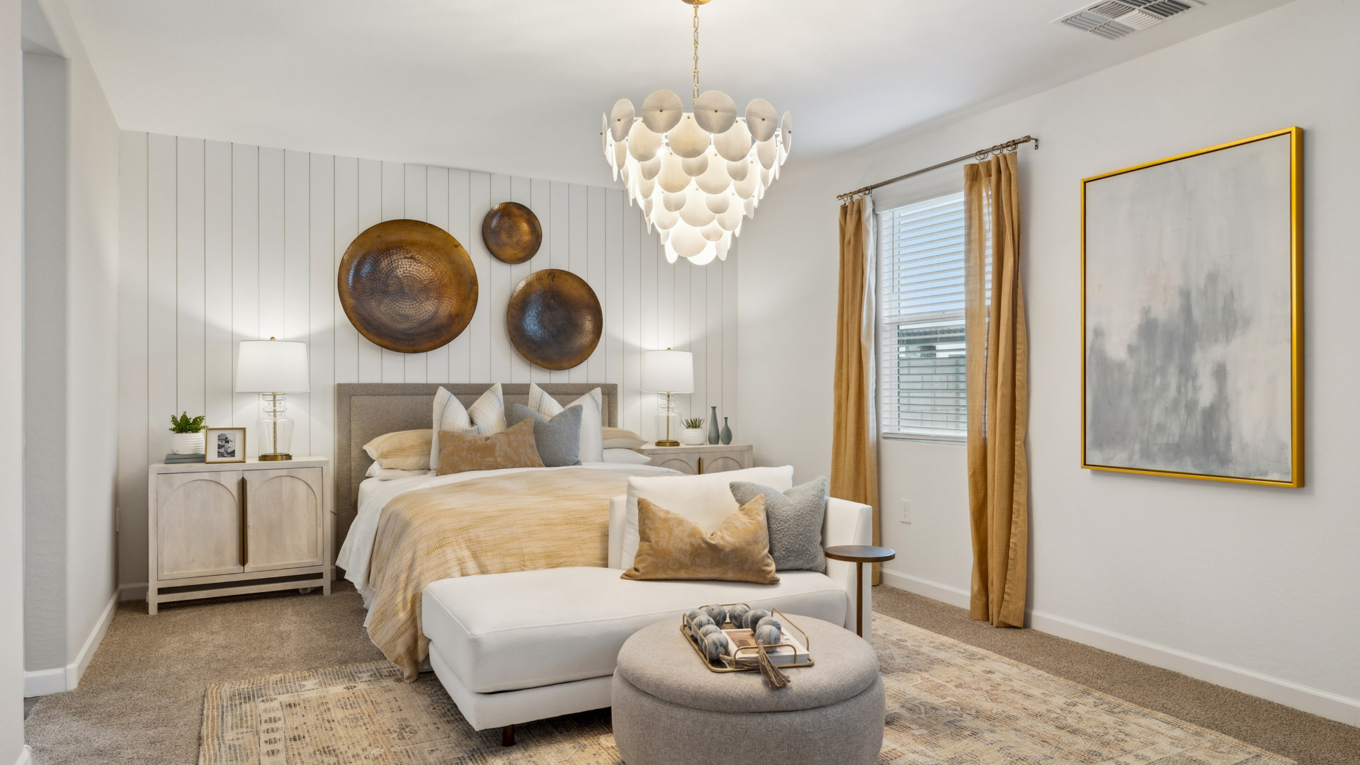 A spacious primary bedroom emphasizing open space and natural lighting.