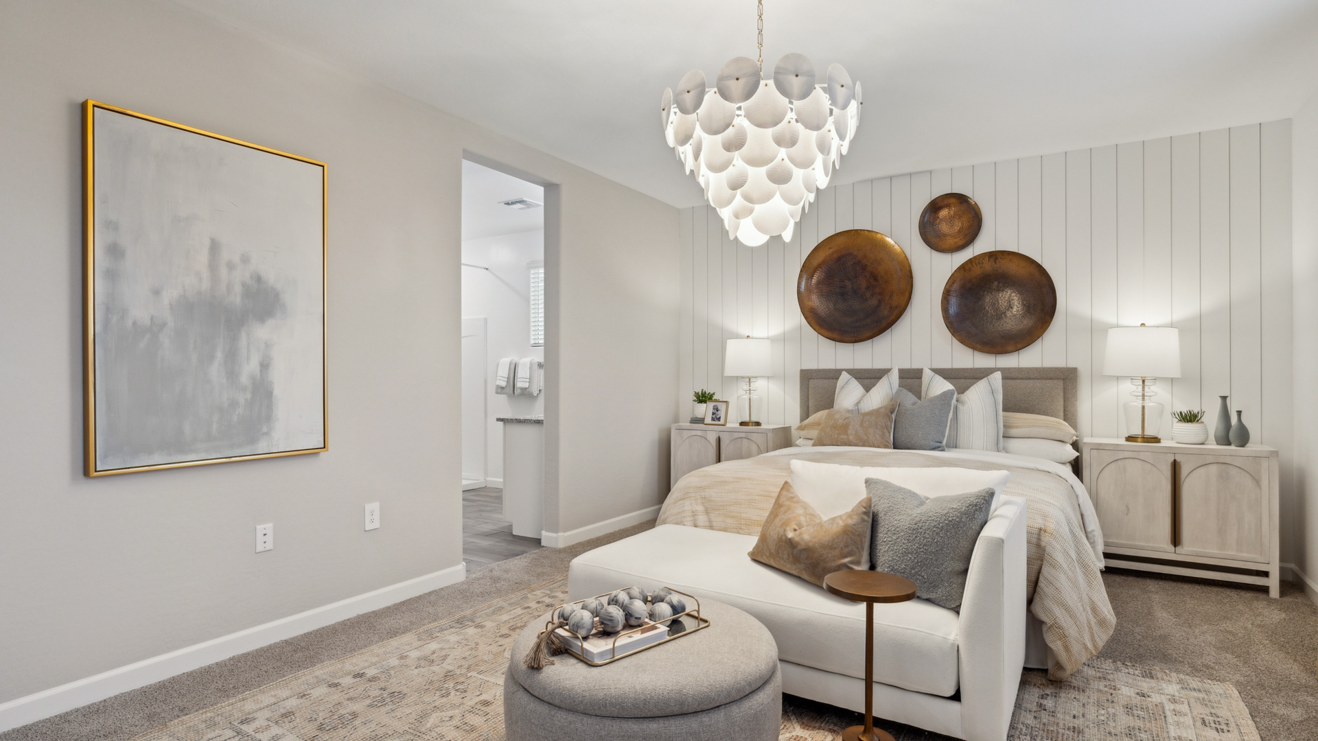 A spacious primary bedroom emphasizing open space and natural lighting.