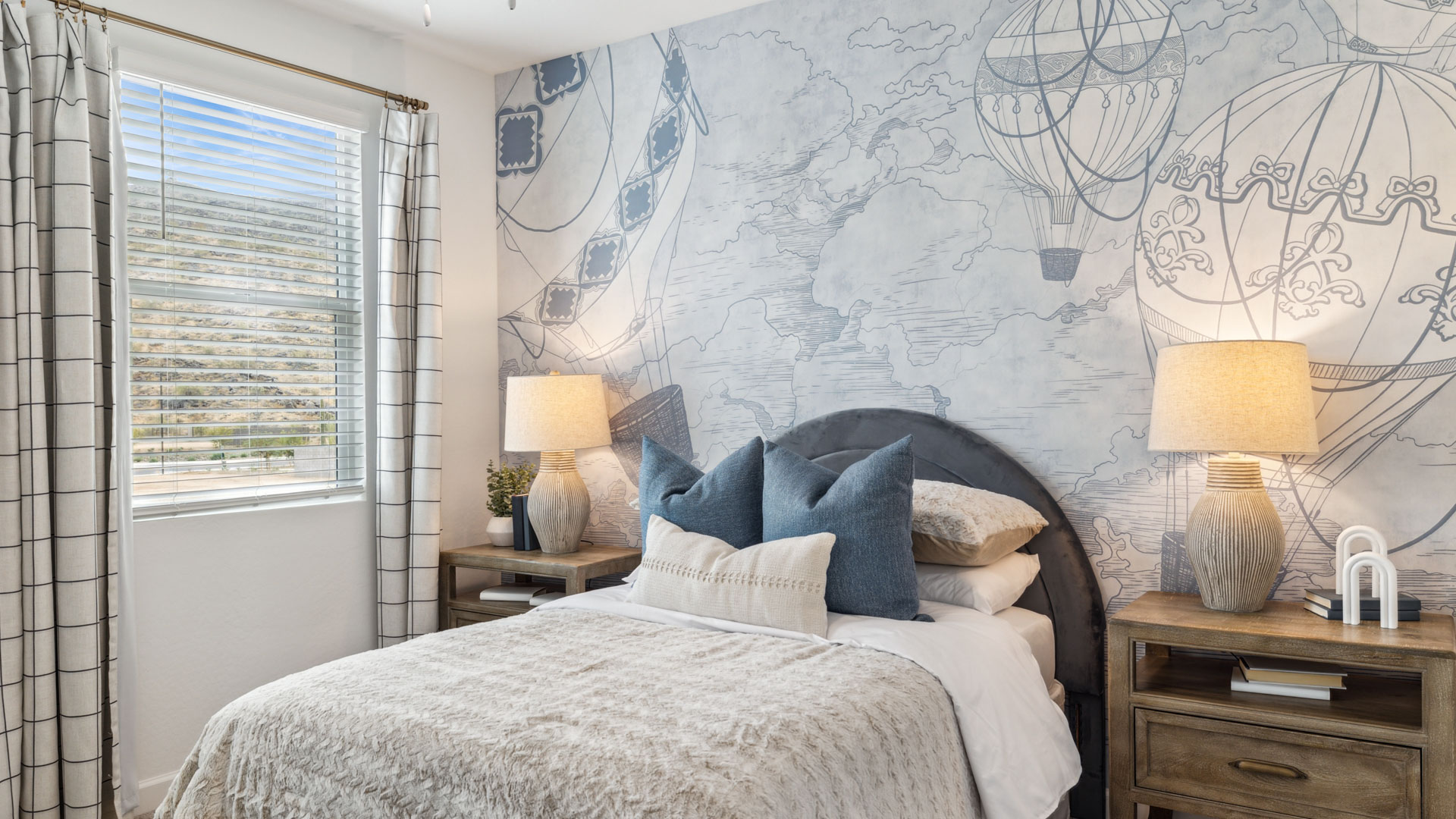 Comfortable guest bedroom featuring neutral-toned walls and a large closet.