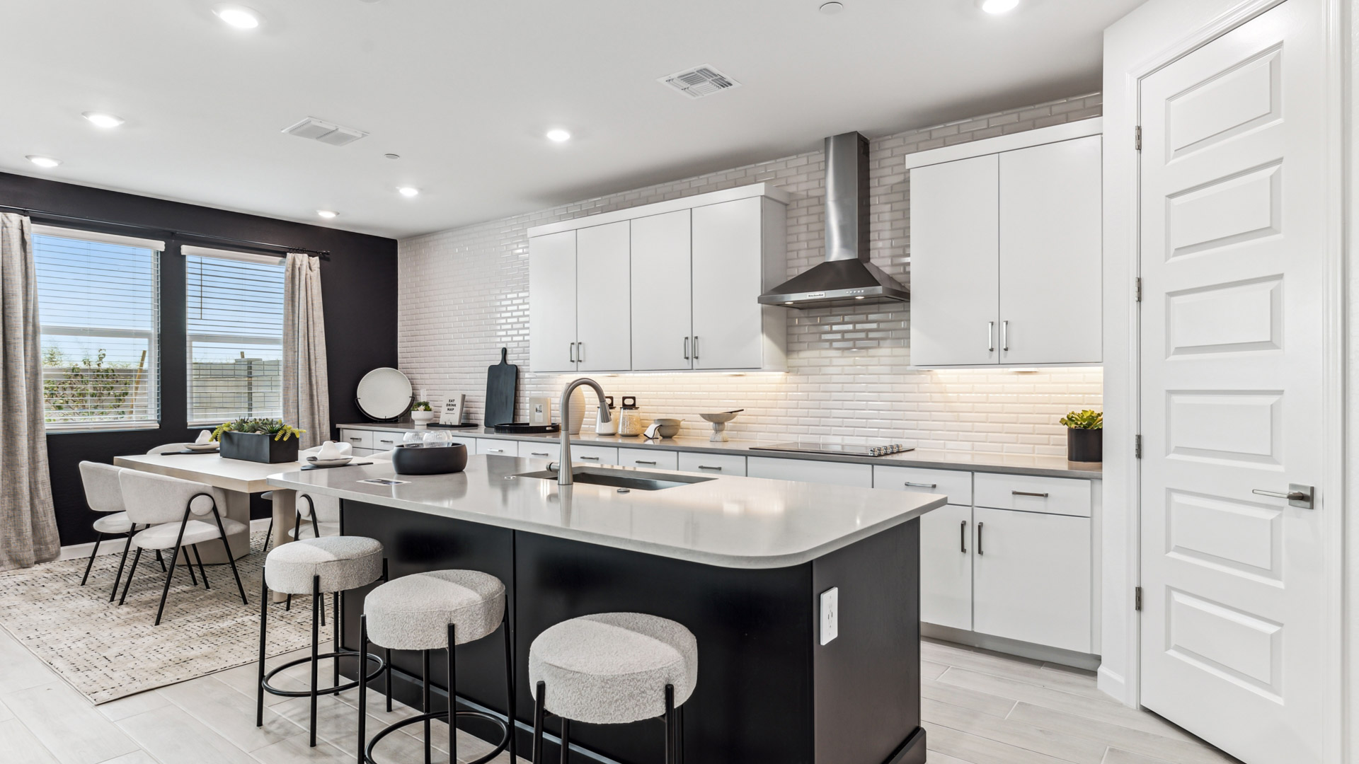 Island kitchen layout with new appliance suite included, storage, pantry, sink, and functional prep zones