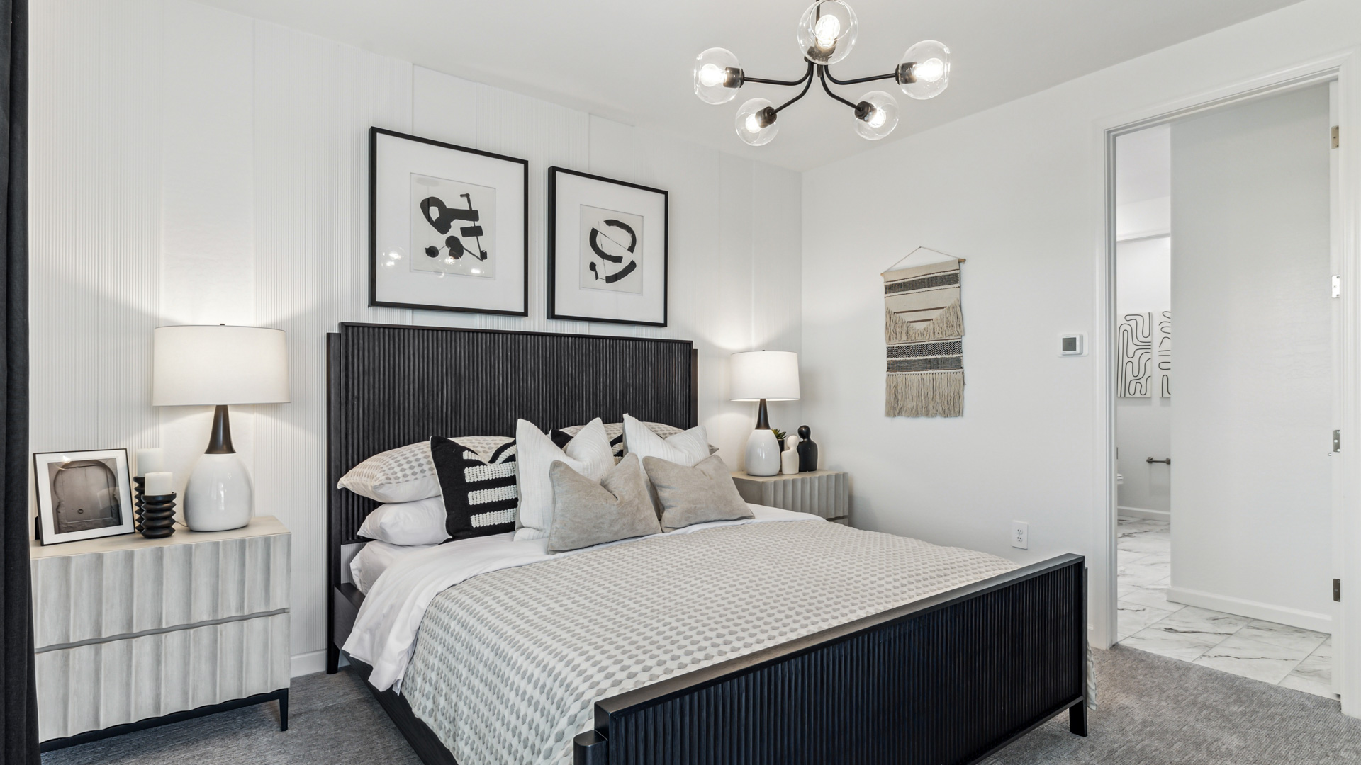 primary suite with balcony and walk in closet