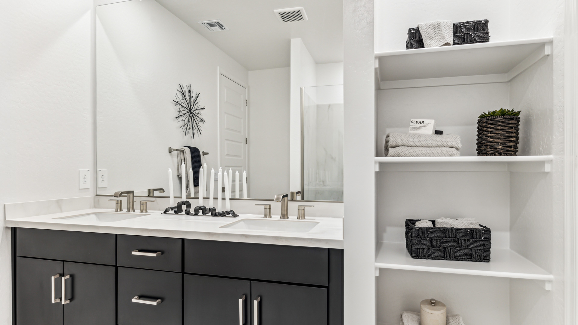 primary bathroom with dual vanities