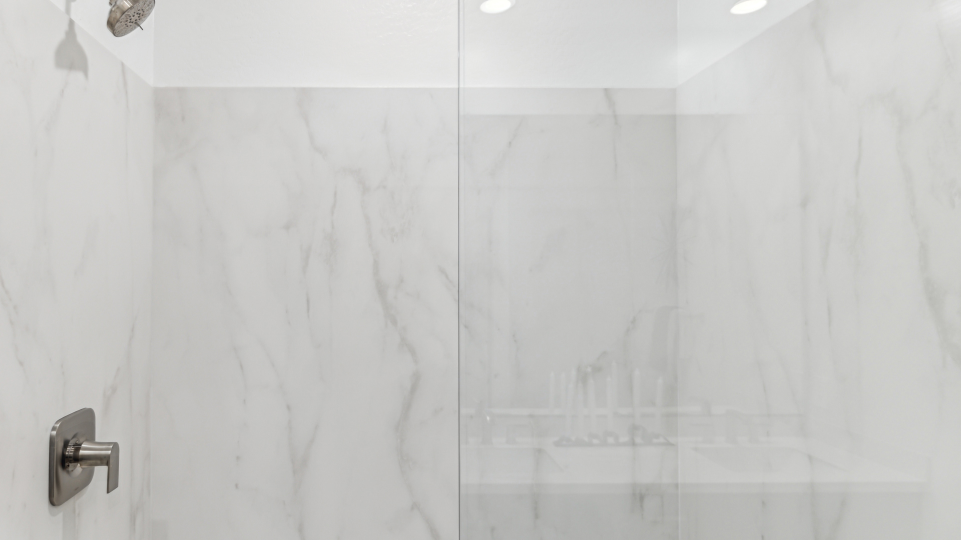 primary bathroom with dual vanities