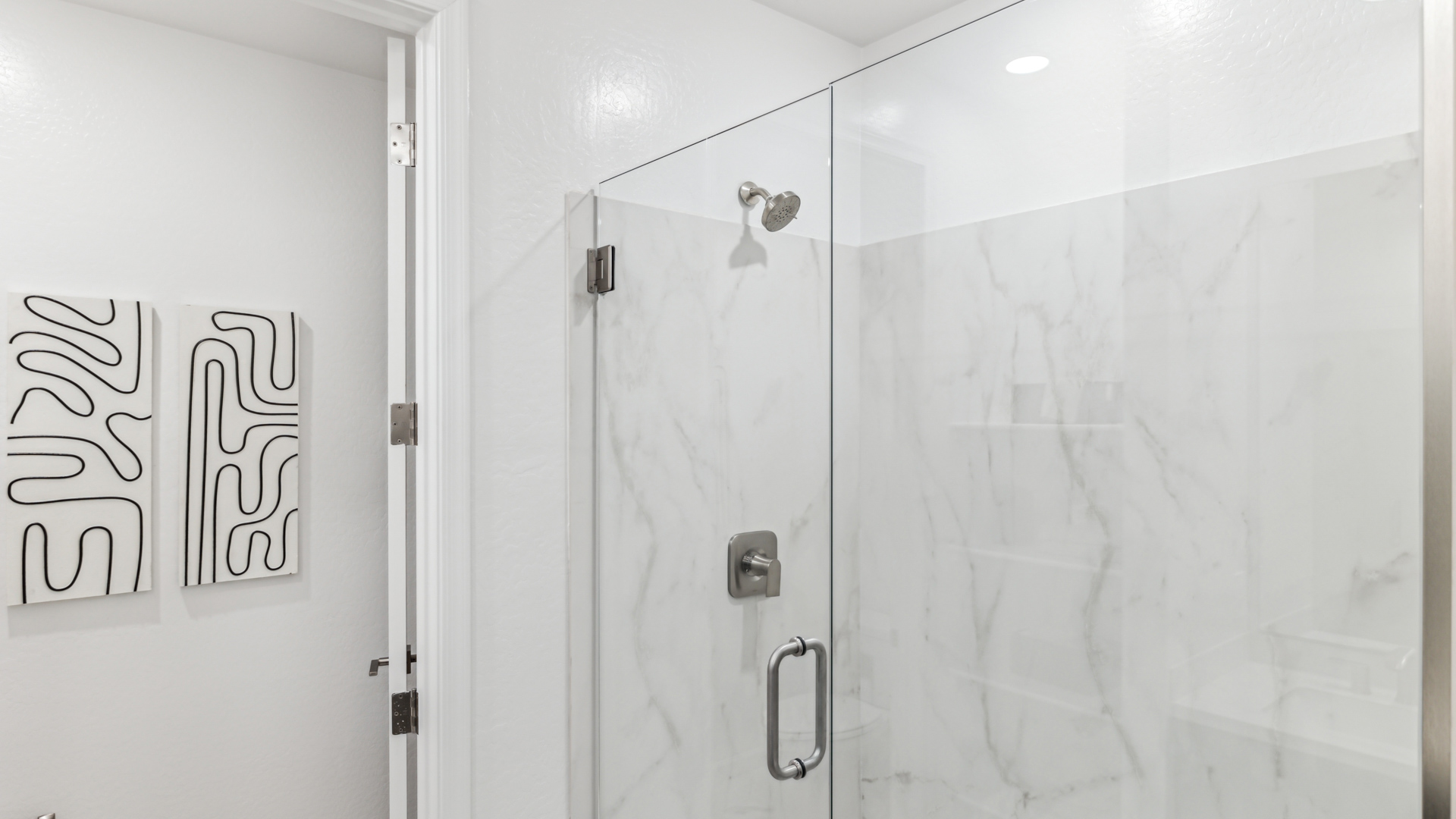 primary bathroom with dual vanities
