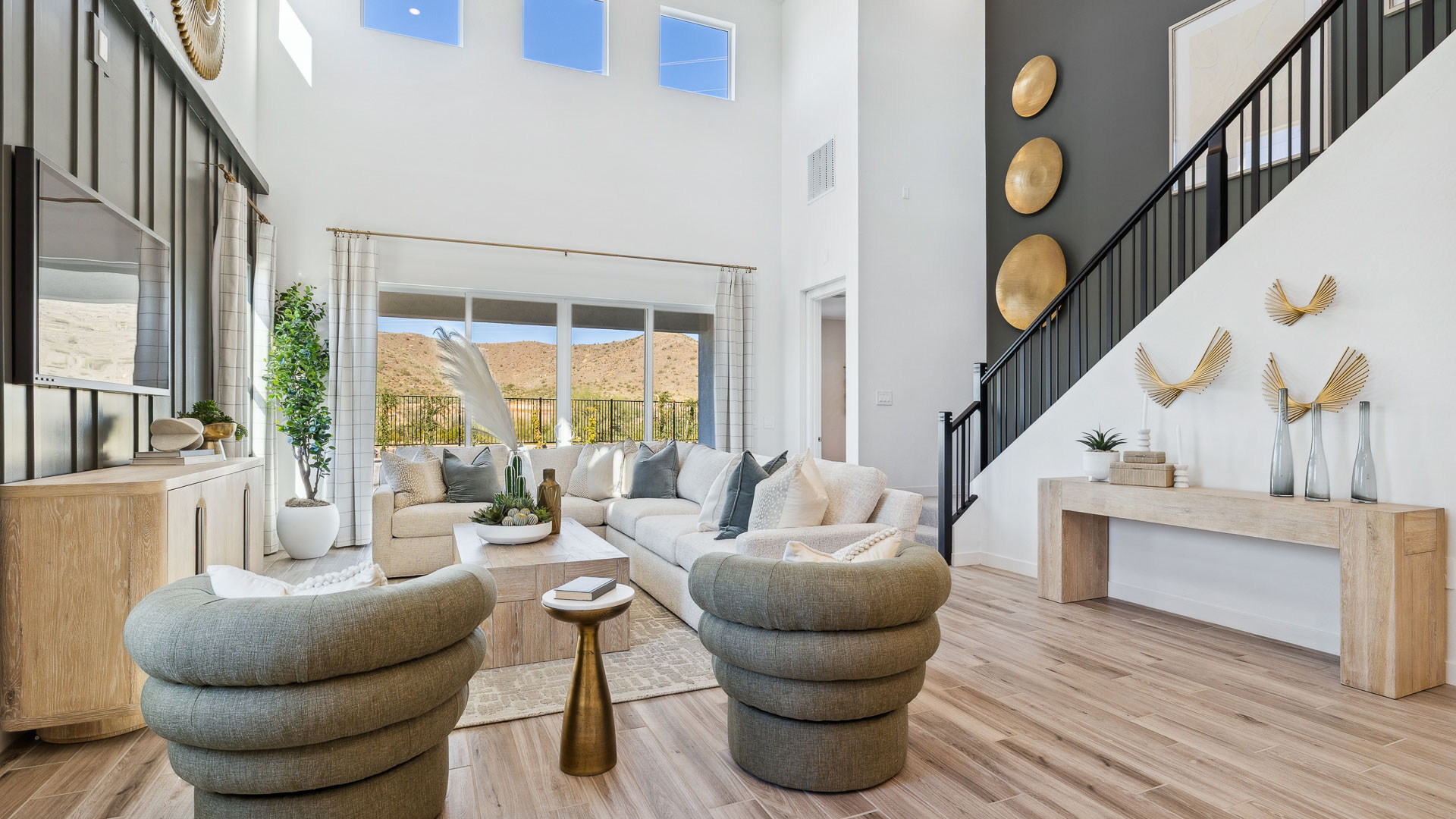 A well-organized living room that includes a kitchen and dining area, creating a warm and welcoming environment for gatherings.