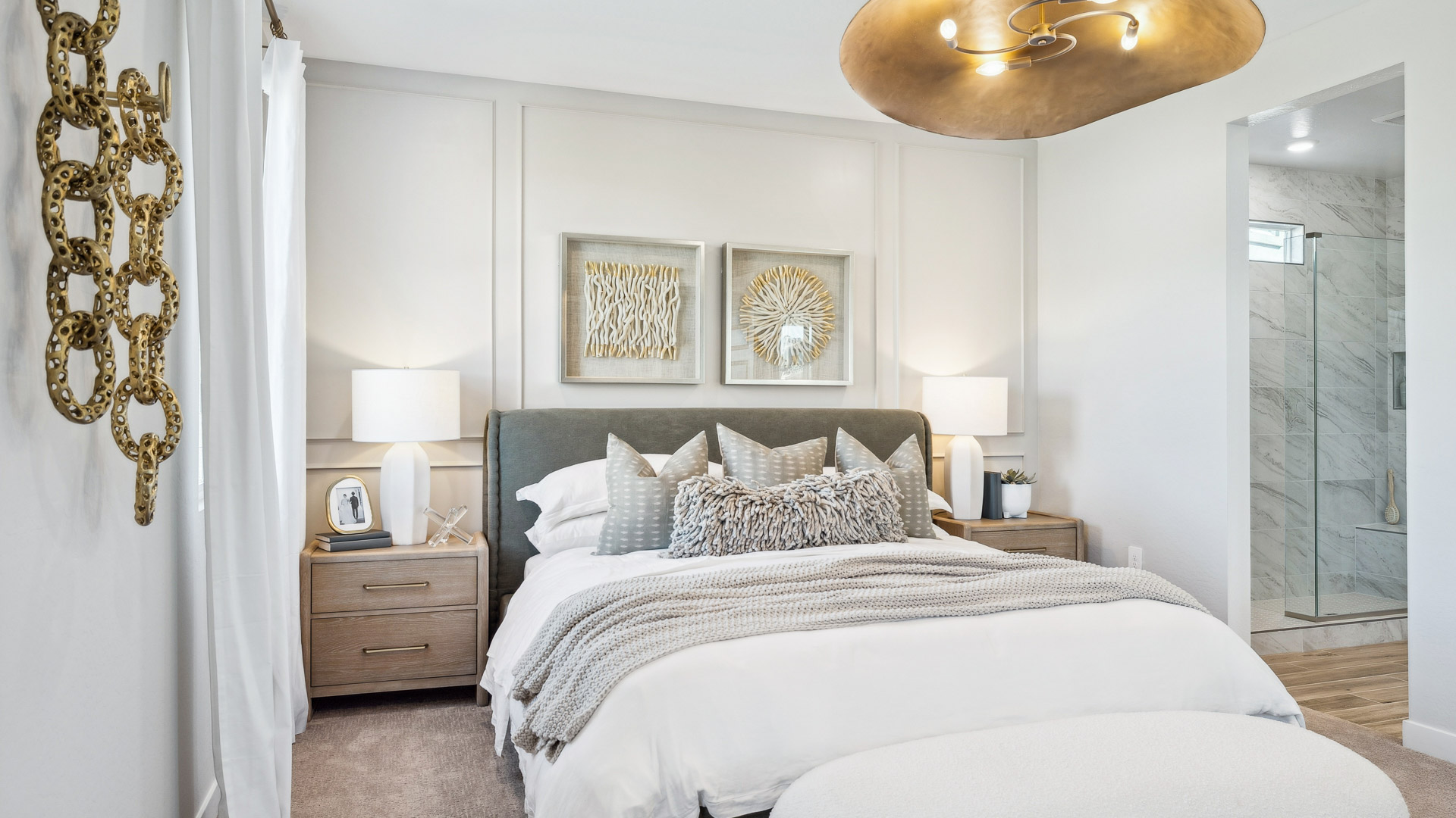 A spacious primary bedroom emphasizing open space and natural lighting.