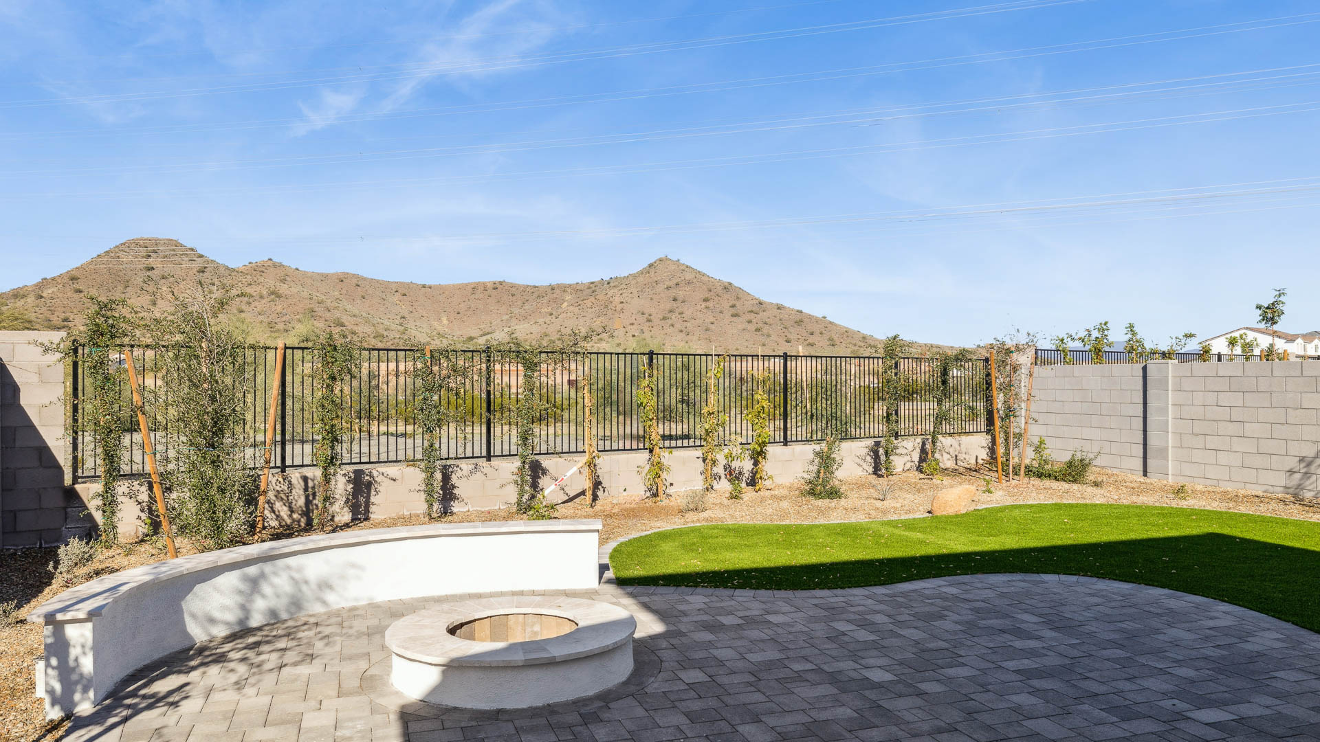 Large fenced-in backyard with a covered patio, perfect for outdoor entertainment.