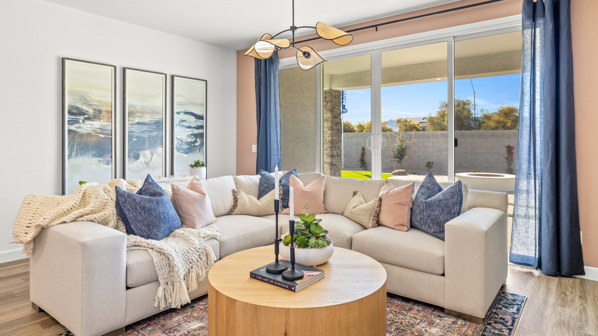 A well-organized living room that includes a kitchen and dining area, creating a warm and welcoming environment for gatherings.