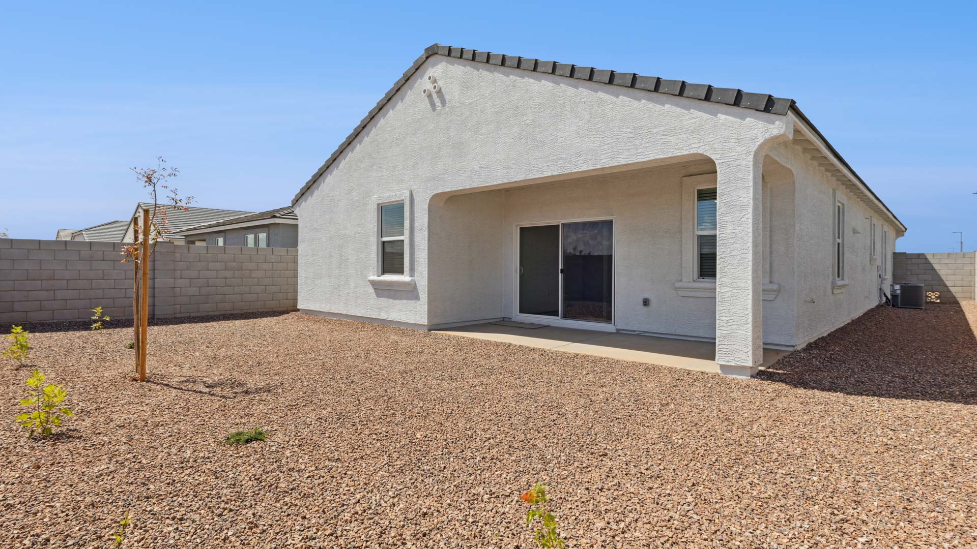 Large fenced-in backyard with a covered patio, perfect for outdoor entertainment. Large fenced-in backyard with a covered patio, perfect for outdoor entertainment.
