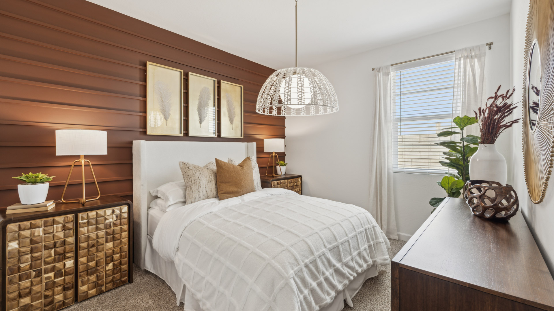 Comfortable guest bedroom featuring neutral-toned walls and a large closet.