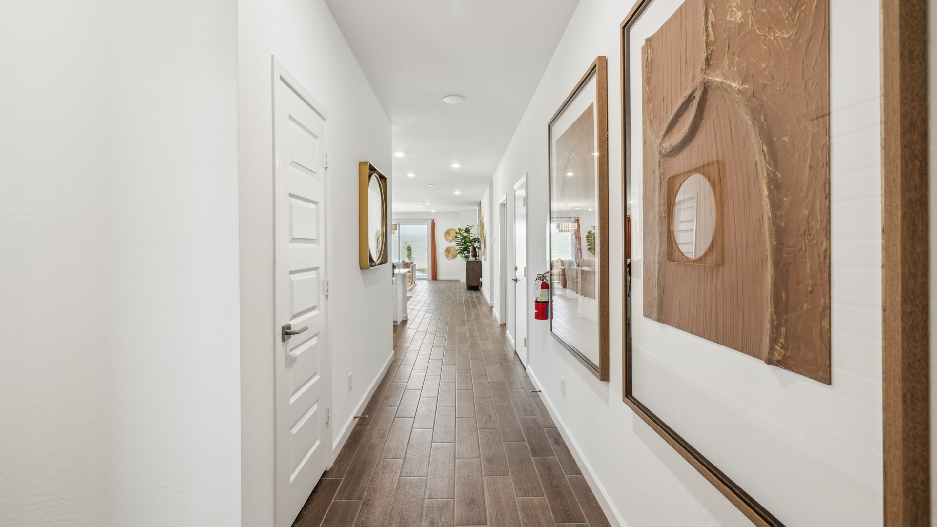 Entry hallway leading to living room and kitchen in the background.
