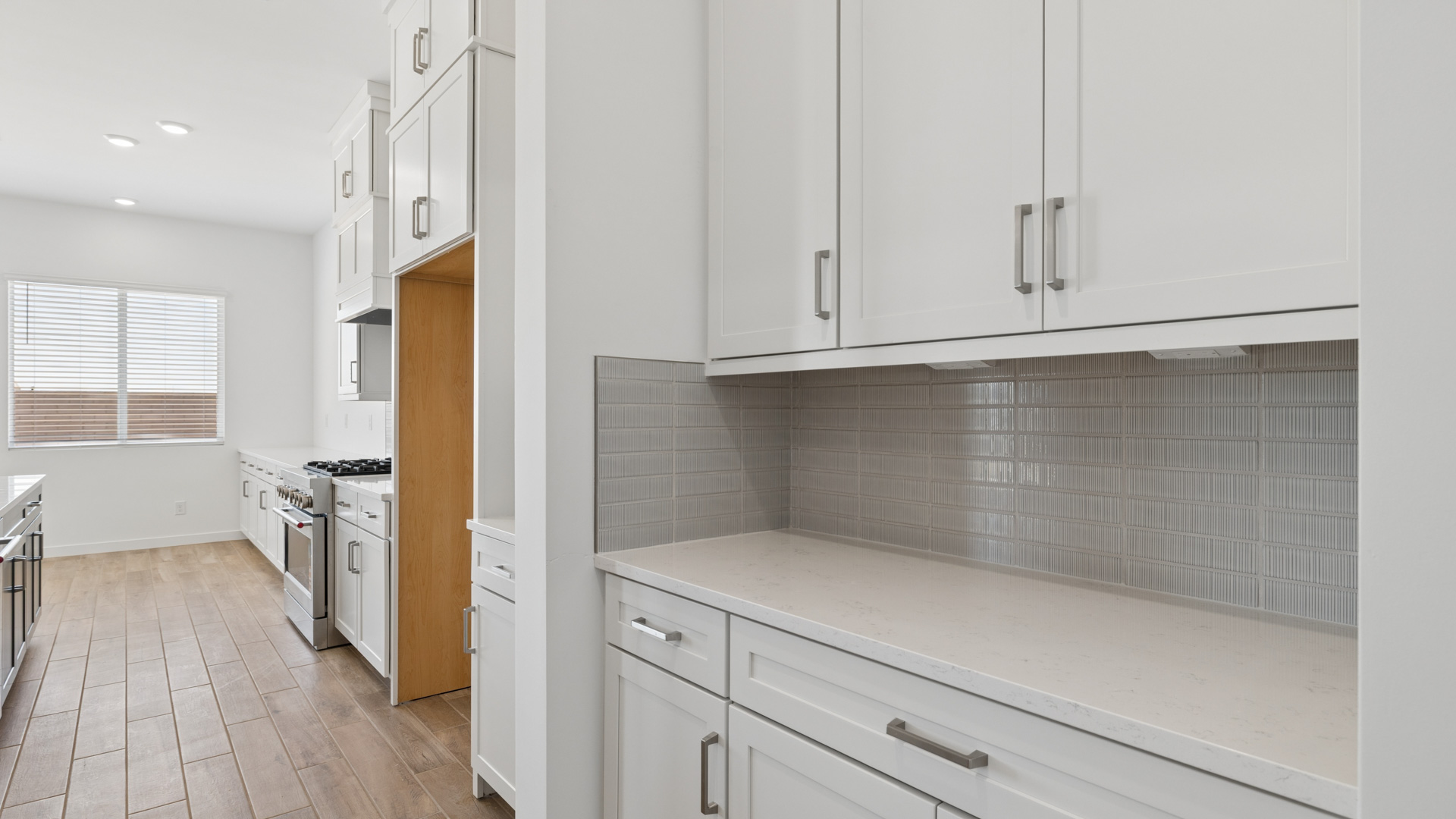 spacious kitchen with large island, walk in closet and floor to ceiling cabinets