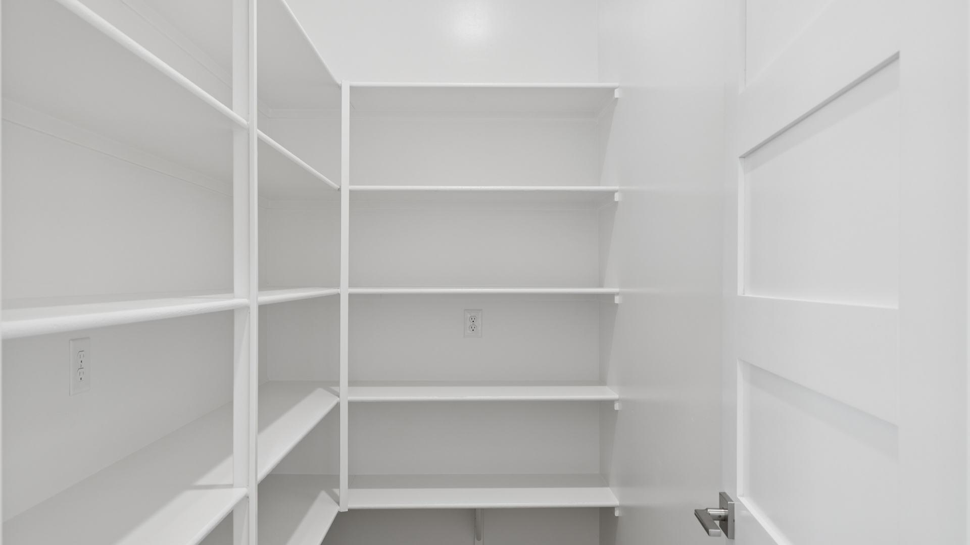 spacious kitchen with large island, walk in closet and floor to ceiling cabinets