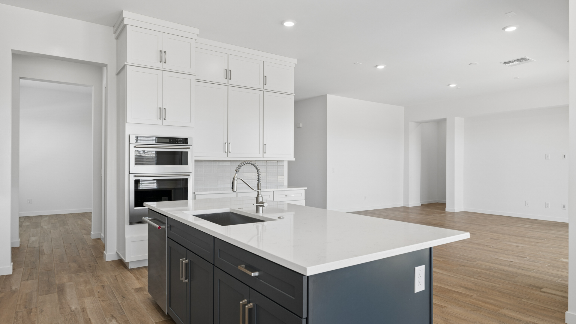 spacious kitchen with large island, walk in closet and floor to ceiling cabinets