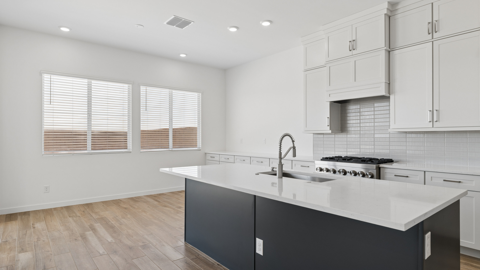spacious kitchen with large island, walk in closet and floor to ceiling cabinets