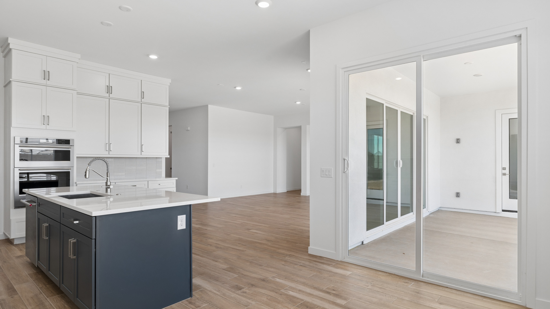 spacious kitchen with large island, walk in closet and floor to ceiling cabinets