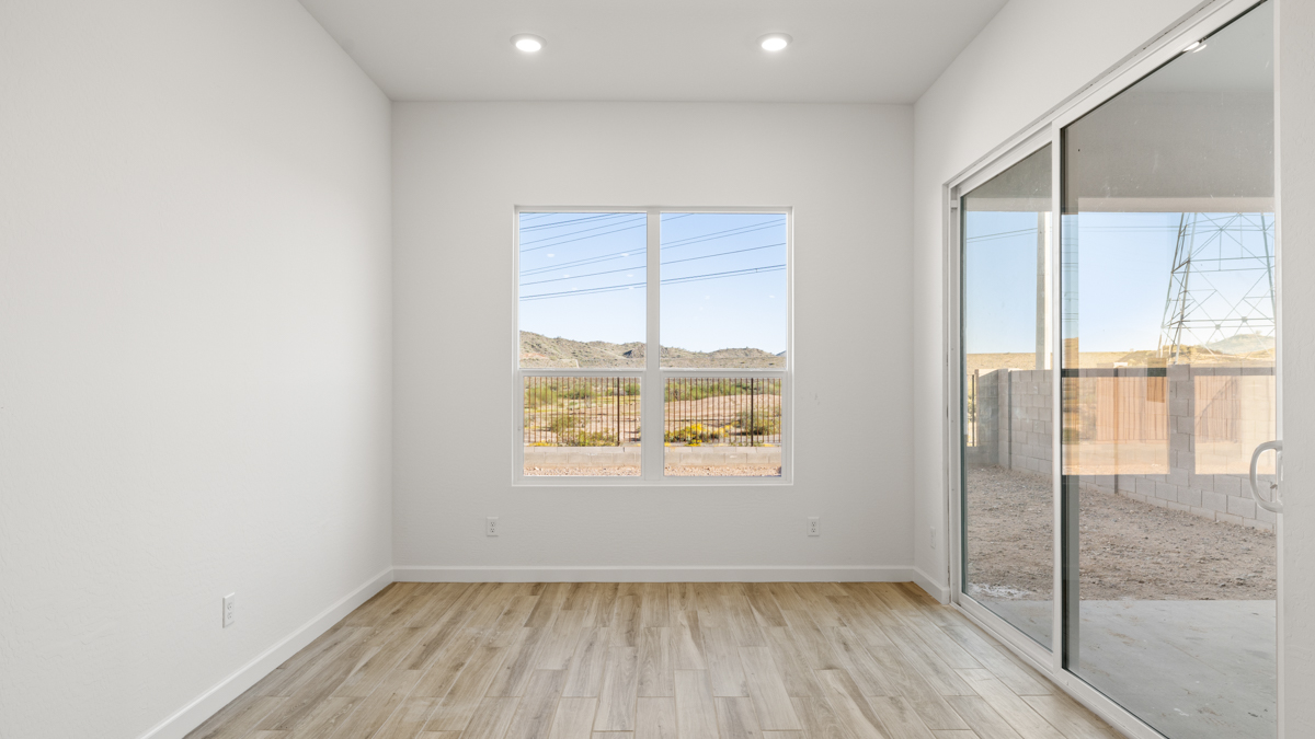 Spacious dining area that connects with the living room, kitchen, and near the sliding doors that lead to the backyard.