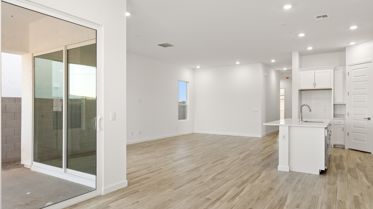 Spacious dining area that connects with the living room, kitchen, and near the sliding doors that lead to the backyard.