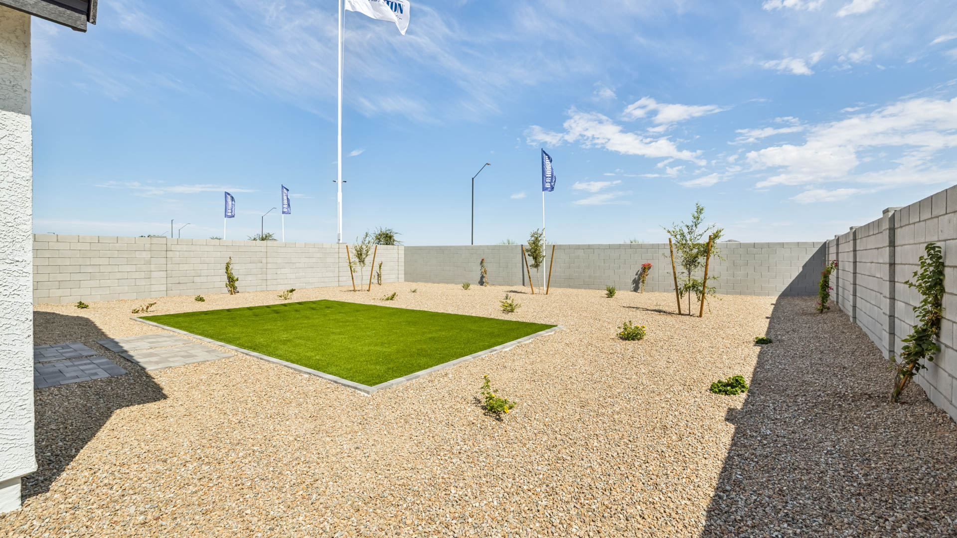 Large fenced-in backyard with a covered patio, perfect for outdoor entertaining.
