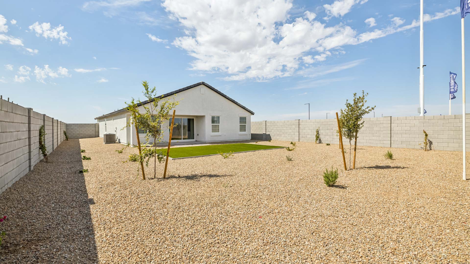Large fenced-in backyard with a covered patio, perfect for outdoor entertaining.