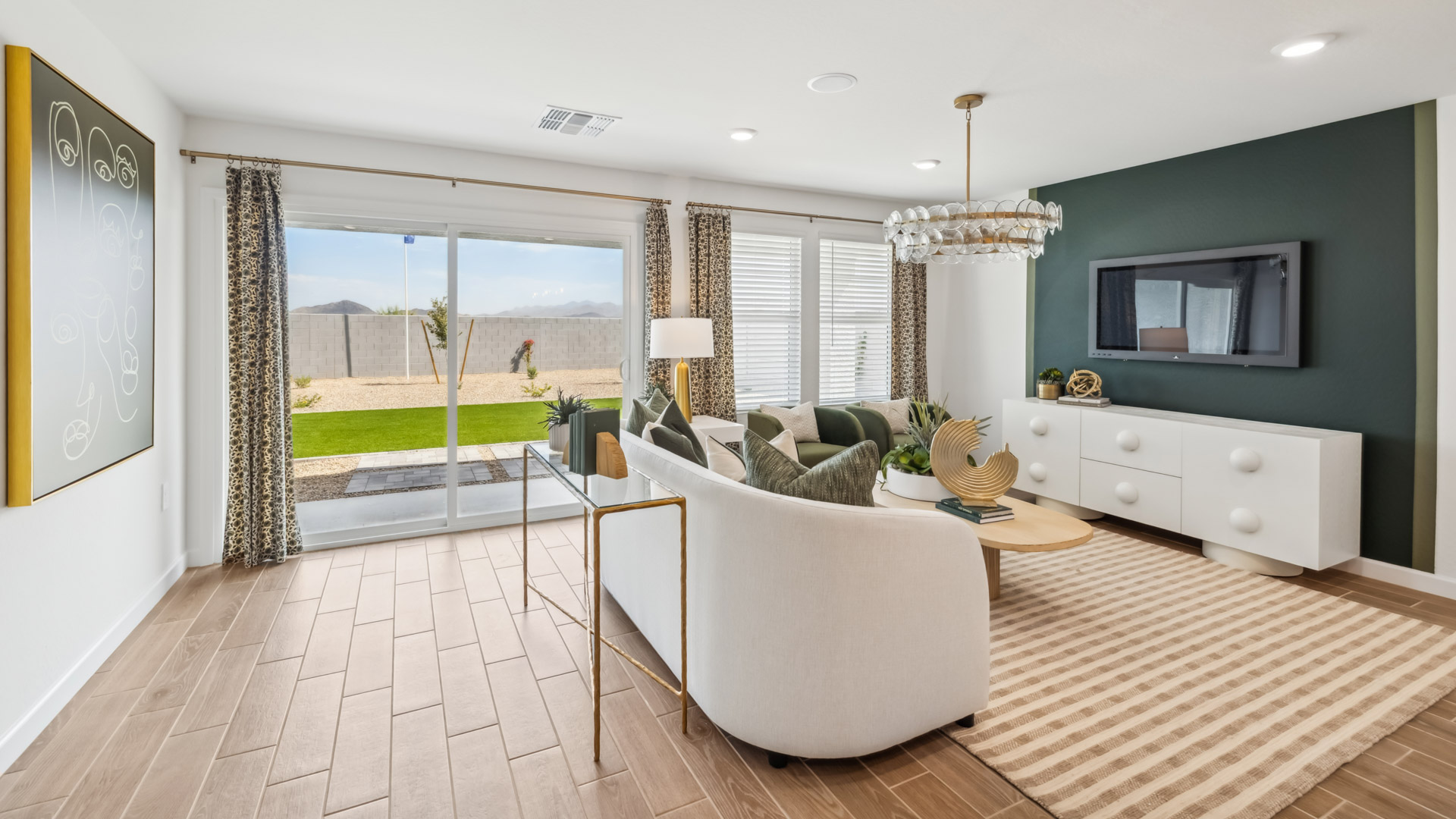 A well-organized living room that includes a kitchen and dining area, creating a warm and welcoming environment for gatherings.