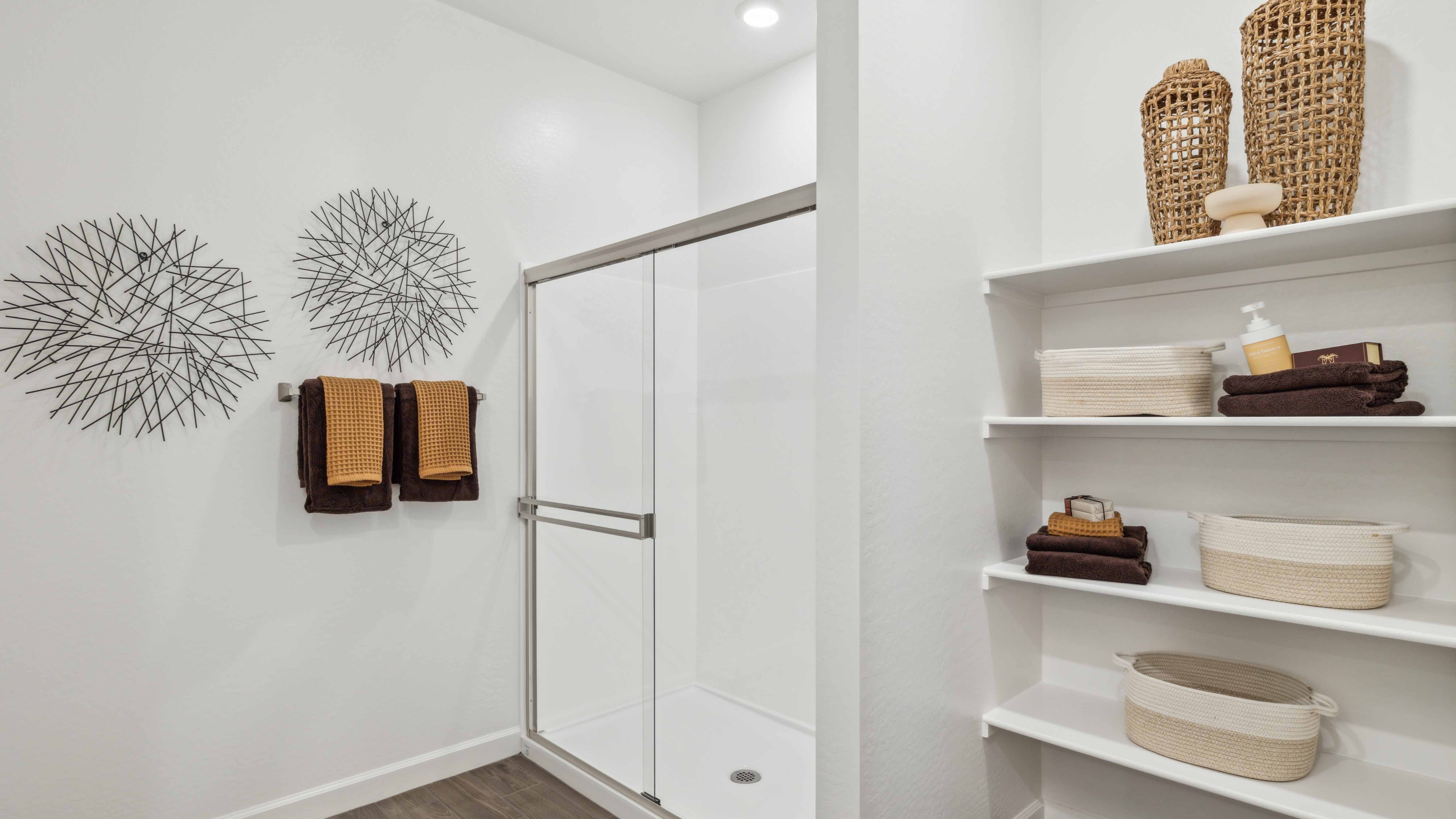 primary bathroom with dual vanities
