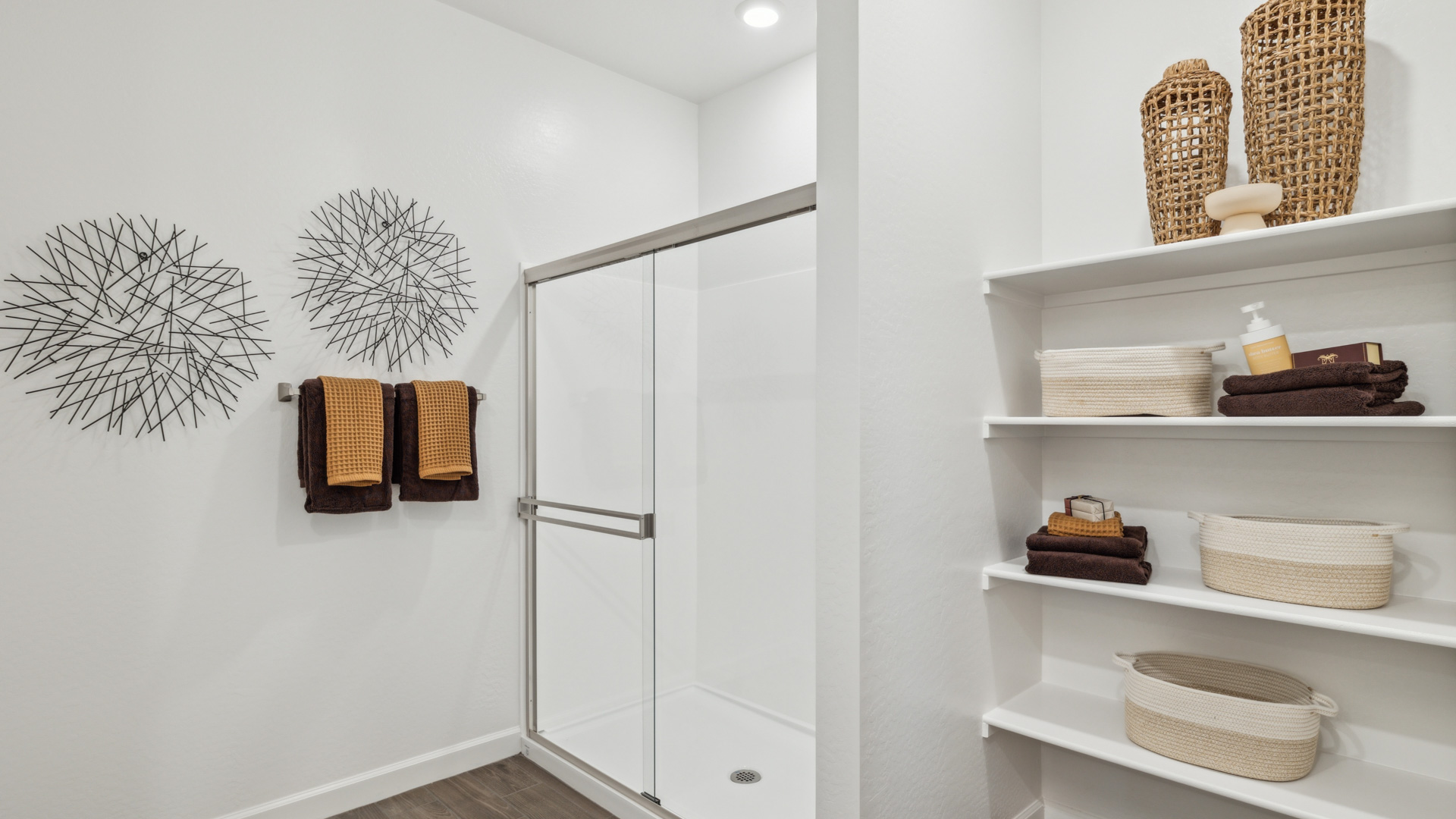 primary bathroom with dual vanities