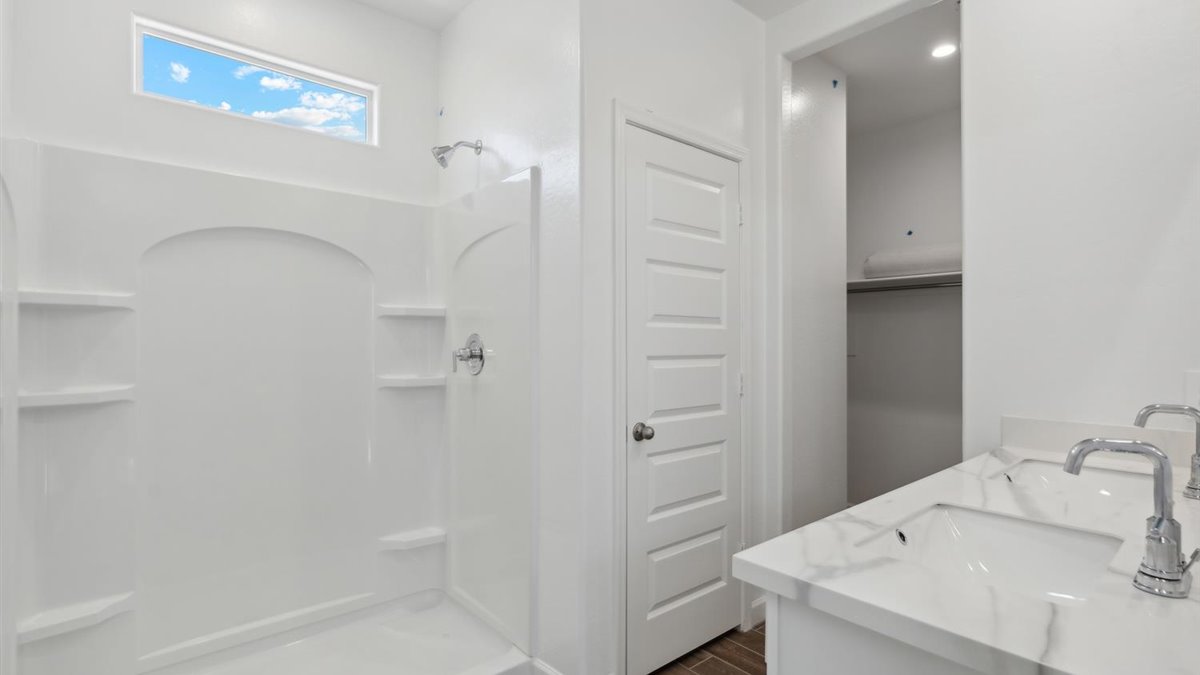 Owner’s ensuite adds stylish appeal, spa-inspired design, and access to walk-in shower, bedroom, walk-in closet